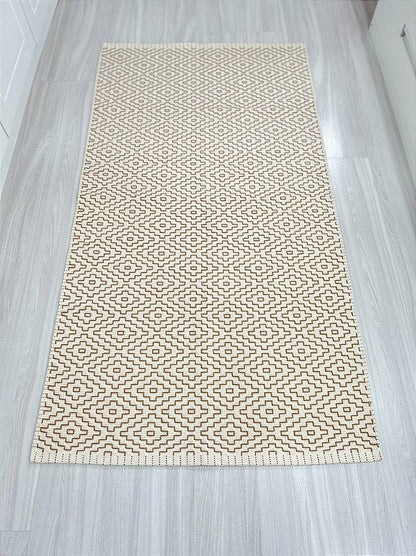 Tapete bordado G caramelo 75 x 140 cm